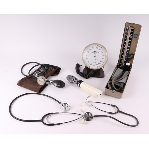 448 - A quantity of vintage medical instruments to include a stethoscope, reflex hammers and blood pressur... 