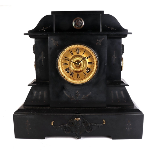 464 - A Victorian black slate mantle clock of architectural form with applied female mask decoration, the ... 