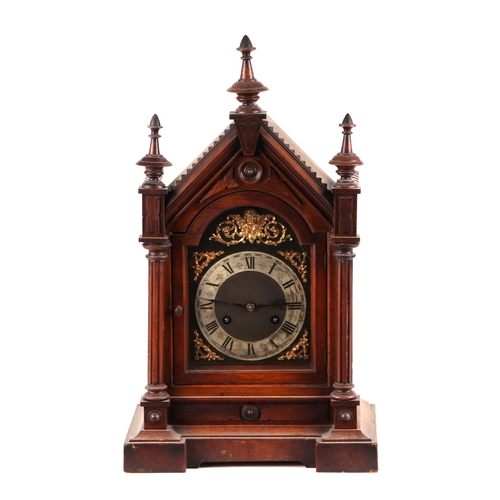 471 - An Edwardian walnut architectural mantle clock, the brass dial with silvered chapter ring and Roman ... 