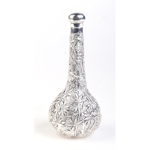 501 - A Chinese silver coloured metal scent bottle marked 'Shanghai Woshing', 10cms high; together with a ... 