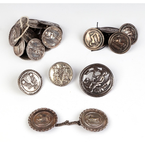 504 - A quantity of 18th century Dutch white metal buttons and a cloak clasp, decorated with figures and h... 