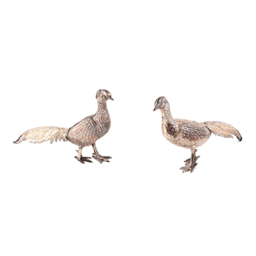 506 - A pair of Spanish silver models of pheasants, largest 16cm long, 68g.