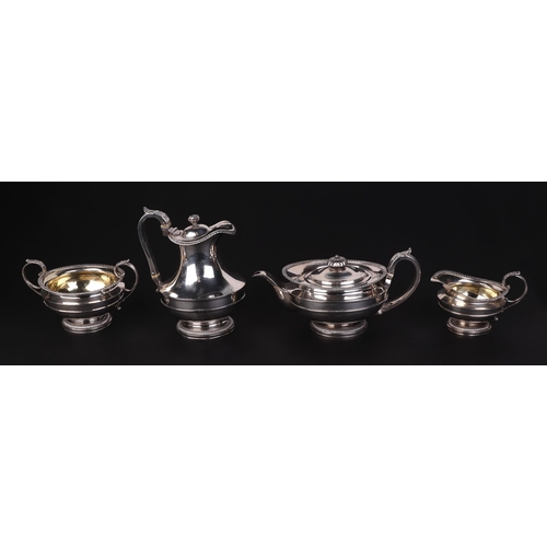 508 - A George III four-piece silver tea set, London 1818 and bearing the crest of possibly for Squire Osb... 