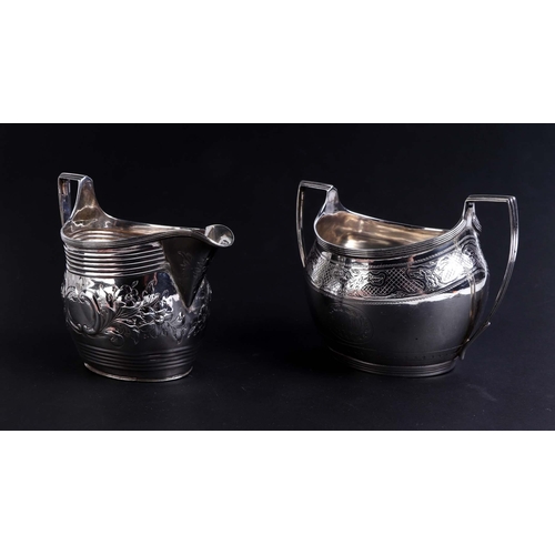 525 - A George III silver milk jug, London 1800; together with a silver twin-handled sugar bowl, London 18... 