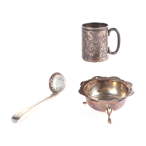 533 - A silver Christening tankard; together with a silver three legged bowl and a Victorian silver sifter... 