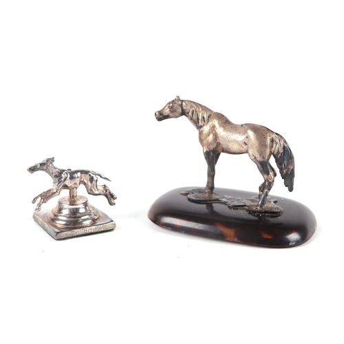 535 - An Edwardian silver model of a pony on a tortoiseshell base, London 1909, 6cms high; together with a... 