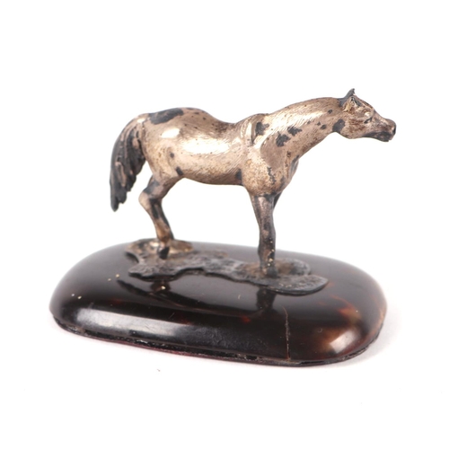 535 - An Edwardian silver model of a pony on a tortoiseshell base, London 1909, 6cms high; together with a... 