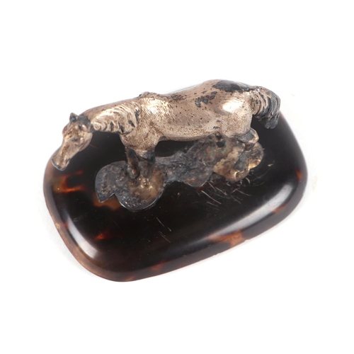 535 - An Edwardian silver model of a pony on a tortoiseshell base, London 1909, 6cms high; together with a... 