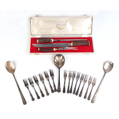 553 - A silver plated two-handled tray; together with an antler handled carving set and other silver plate... 