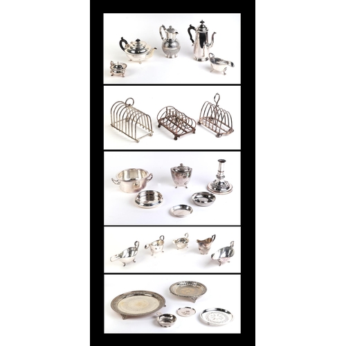 555 - A quantity of assorted silver plated items to include a George III style sauce boats, toast racks, w... 