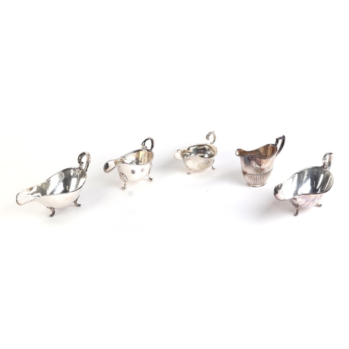 555 - A quantity of assorted silver plated items to include a George III style sauce boats, toast racks, w... 