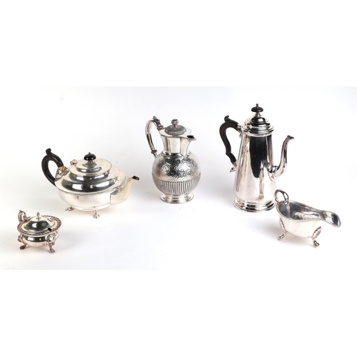 555 - A quantity of assorted silver plated items to include a George III style sauce boats, toast racks, w... 