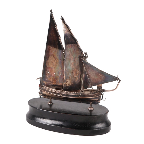 561 - A Maltese silver model of a sailing ship, overall 15cms high.