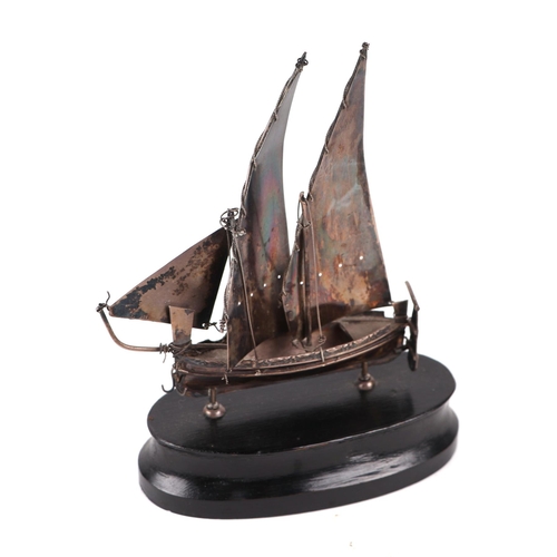 561 - A Maltese silver model of a sailing ship, overall 15cms high.