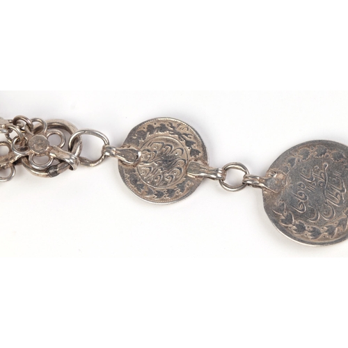 569 - A Persian silver coin belt.