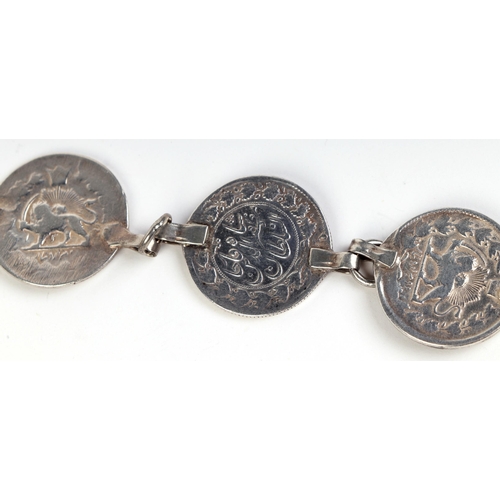 569 - A Persian silver coin belt.