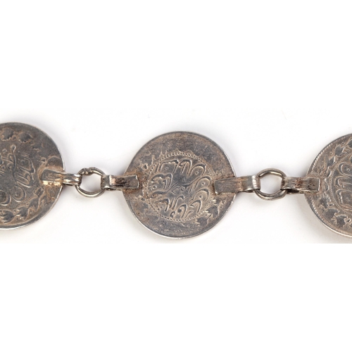 569 - A Persian silver coin belt.