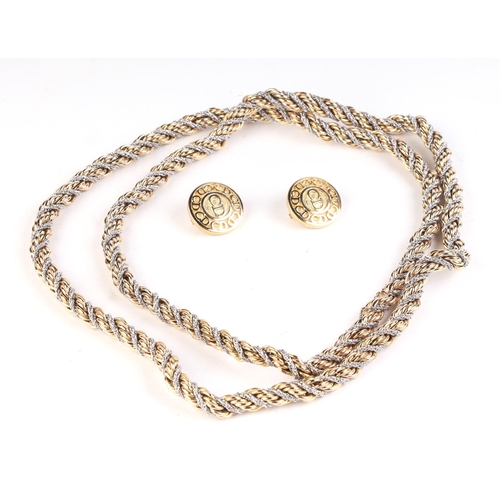 574 - Christian Dior:  A rope twist bi-metal necklace, 96cms long; together with a pair of Christian Dior ... 