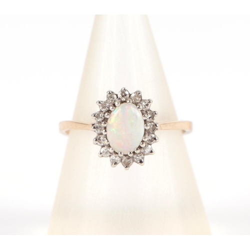 587 - A 9ct gold opal and diamond cluster ring, approx UK size L, 1.8g.