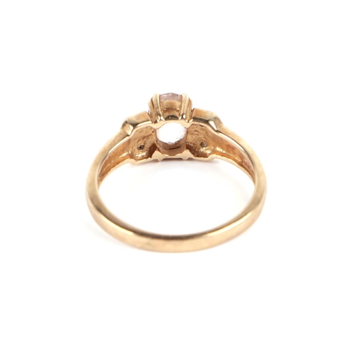 589 - A 9ct gold ring, with central morganite and diamond set shoulders, approx UK size N, 2.7g