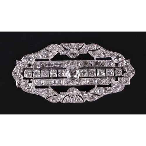 593 - An Art Deco platinum and diamond panel brooch, the central brilliant cut diamond approx 0.47ct, 16 t... 