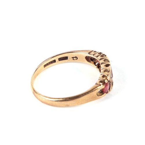 594 - A 9ct gold dress ring set with pale pink and white stones, approx UK size R, 3.1g.