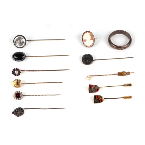 596 - A group of stick pins to include enamel, agate and citrine; together with a silver gilt ingot pendan... 