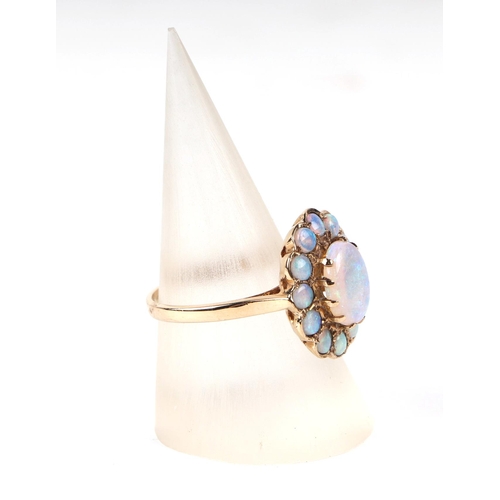 598 - A 9ct gold opal cluster ring, approx UK size M, 3.4g, together with it's original 1991 purchase reci... 