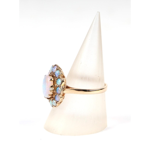 598 - A 9ct gold opal cluster ring, approx UK size M, 3.4g, together with it's original 1991 purchase reci... 