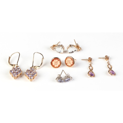 603 - A pair of 14ct gold earrings; together with a pair of 10ct white gold stud earrings; a pair of 14ct ... 