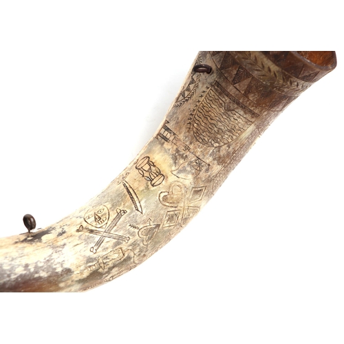 61 - A cow horn powder flask with scrimshaw decoration (a/f), approx 13cms long.