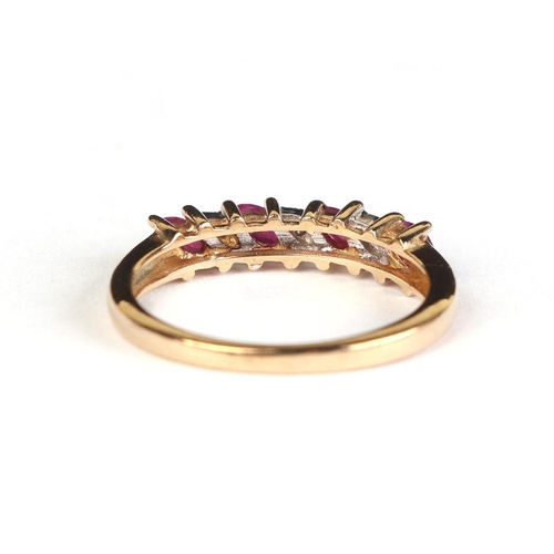 615 - A yellow metal seven stone ruby and diamond ring, approx UK size P, 2.4g.