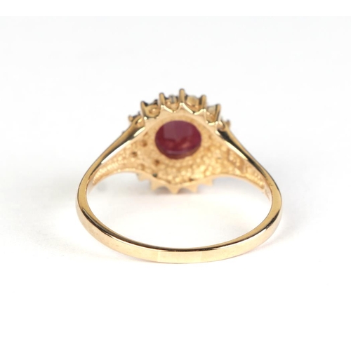 618 - A 9ct gold ruby and diamond cluster ring, approx UK size T, 3g.