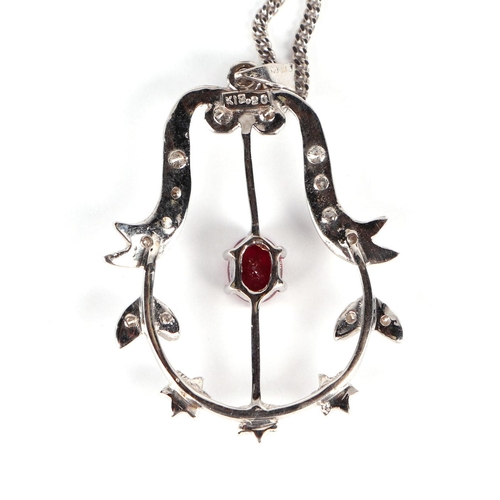 630 - An 18ct white gold diamond and ruby pendant on a fine 18ct white gold chain, 5g.Condition ReportRuby... 