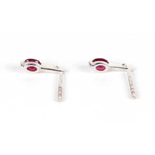 632 - A pair of 18ct gold diamond and ruby earrings.Condition ReportOne butterfly is a 9ct white gold repl... 