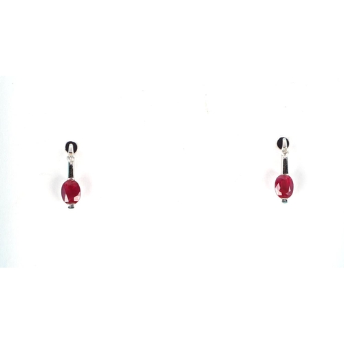 632 - A pair of 18ct gold diamond and ruby earrings.Condition ReportOne butterfly is a 9ct white gold repl... 