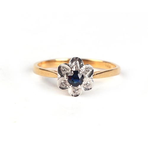 633 - An 18ct gold diamond and sapphire flower ring, approx UK size 'N', 2.2g.