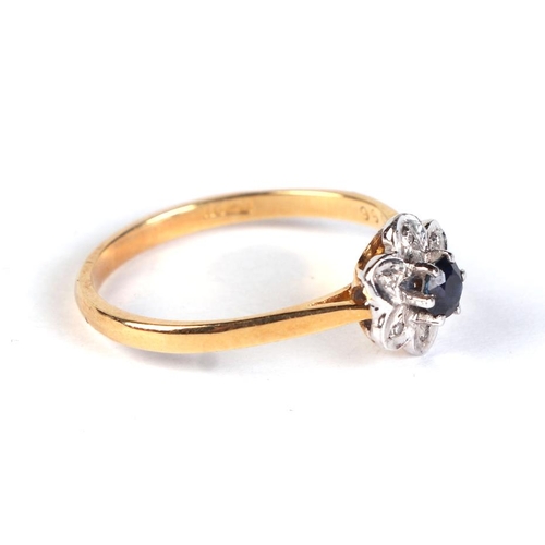 633 - An 18ct gold diamond and sapphire flower ring, approx UK size 'N', 2.2g.