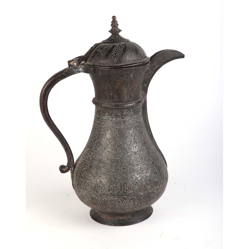 639 - A Middle Eastern tinned copper ewer or coffee pot, 33cms high.