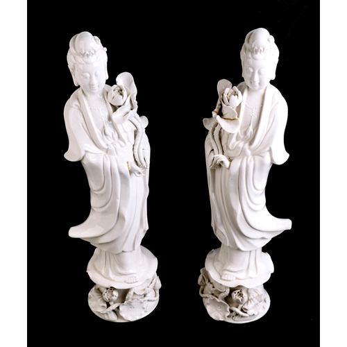 644 - A pair of Chinese blanc de chine figures depicting Guanyin, 36cms high; together with a blanc de chi... 