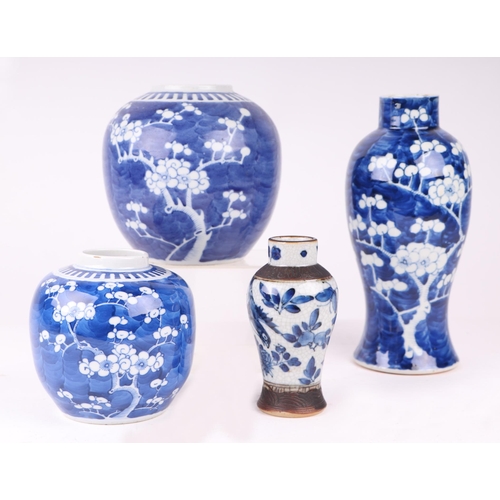 645 - A Chinese blue & white baluster vase decorated with prunus, 25cms high; together with two similar gi... 