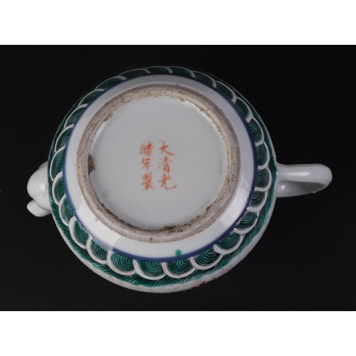 646 - A Chinese porcelain teapot decorated with a pair of five-clawed dragons flying amidst swirling cloud... 