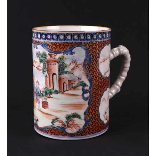 648 - An 18th century Chinese Mandarin mug decorated with figures in landscapes within panels, 11cms high;... 