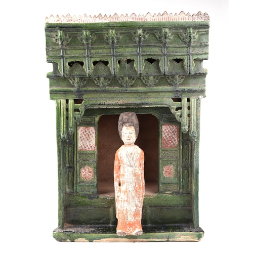 653 - A Chinese green glazed pottery altar, 30cms wide; together with a Chinese pottery funereal figure, 2... 