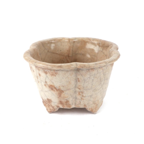 660 - A Chinese pale celadon crackleware lobed planter, 15cms wide.