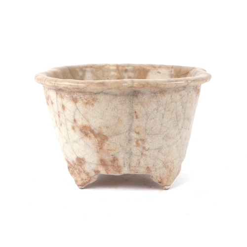 660 - A Chinese pale celadon crackleware lobed planter, 15cms wide.