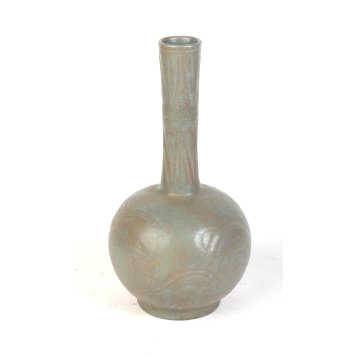 661 - A Chinese celadon glazed bottle vase decorated with a crane and flowers, 28cms high.