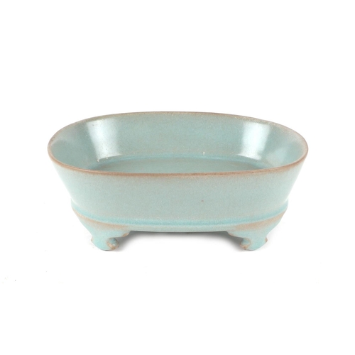 662 - A Chinese celadon glazed brush washer, 17cms wide.