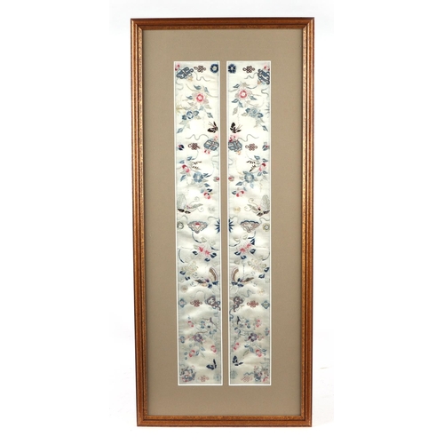 667 - A pair of Chinese silk embroidered panels depicting flowers and butterflies, framed & glazed as one,... 