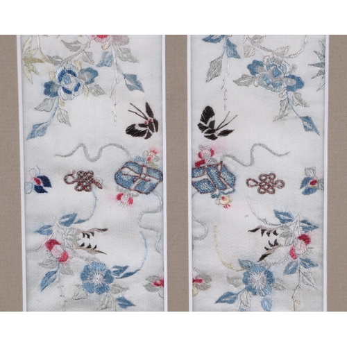 667 - A pair of Chinese silk embroidered panels depicting flowers and butterflies, framed & glazed as one,... 